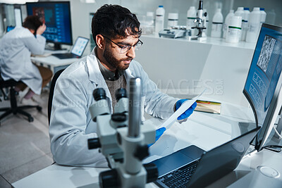 Buy stock photo Report, science and technology with man in laboratory for development, innovation or research. Computer, paper and pharmaceuticals with scientist for medical breakthrough, discovery or chemistry