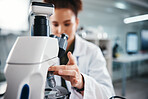 Microscope, woman and scientist for healthcare in lab of experiment research, medical data or study bacteria. Person, researcher and biotechnology for pharmaceutical development of vaccine production