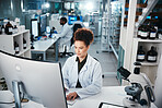 Computer, report and science with woman in laboratory for development, innovation or research. Desktop, pharmaceuticals and study with serious scientist at work on medical breakthrough or discovery