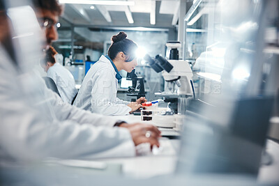 Buy stock photo Medical, research and scientist in laboratory with microscope, observation and experiment for study. Healthcare, employees or doctor with machine for examine cells, microorganisms and investigation