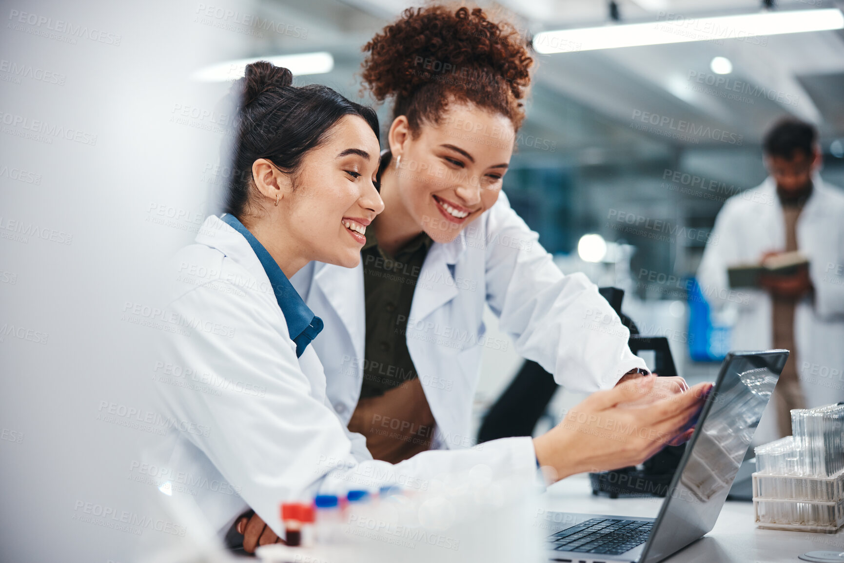 Buy stock photo Laptop, scientist and women with smile, medical research and excited for results of test and pointing. Lab, online and conversation for medicine of healthcare, pharmaceutical and collaboration