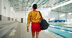 Swimming pool, back or woman at gym for exercise with bag for water sport, hydro fitness or walk. Swimmer, athlete or prepare for training, competition or wellness with practice gear for healthy body