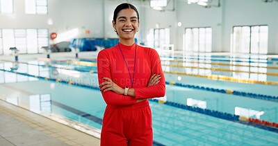 Buy stock photo Smile, crossed arms and portrait of swimming instructor at indoor pool for lesson, workout or training. Happy, confident and woman coach with pride for competition practice at aquatic center.