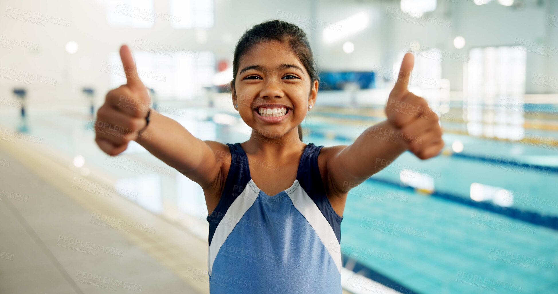 Buy stock photo Portrait, girl and happy with thumbs up at swimming center for training, workout and practice for child development. Female person, agree and smile or confident for sports challenge and tournament