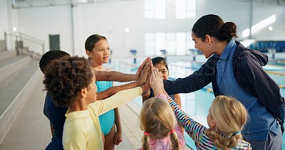 Buy stock photo Swimming pool, lesson and teacher with kids high five for learning, practice and training. Teamwork, celebrate and swimmer instructor with children for exercise, fitness and water sports class