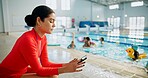 Children, swimming pool and woman with smartphone, distracted and notification with safety issue and risk. Person, water and kids with coach, typing and lifeguard with internet, danger and caution