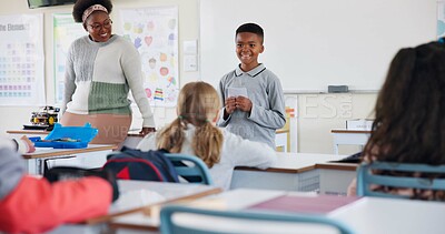 Buy stock photo Class, happy child and reading presentation for learning, education or knowledge in elementary school. Boy, project and speaking to students with teacher for robotics assignment with paper in lesson