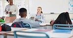 Classroom, happy kid and reading presentation for learning, education or report in elementary school. Girl child, students or speech with teacher for robotics assignment project with paper in lesson