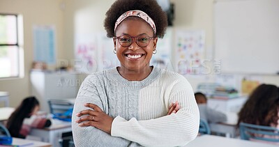 Buy stock photo Crossed arms, teacher and portrait of black woman in classroom with confidence in education career. Smile, pride and African female tutor with job in childhood development at school academy.