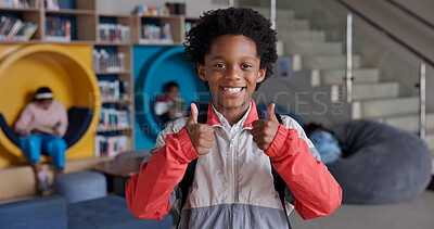 Buy stock photo Portrait, boy and smile with backpack, thumbs up and happy for education in library and joy for learning. Scholarship, proud and student studying in USA, confident and back to school, youth and bag