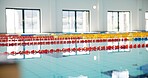 Swimming pool, empty and lines with game, competition and water for sports, cardio workout and dividers. Fitness, blue and swim training arena ready for race performance, lanes and exercise challenge