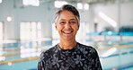 Senior woman, portrait and pool for fitness, wellness and mental health by indoor swimming arena. Elderly person, face and happy in retirement with exercise for cardio, arthritis or aquatic therapy