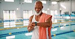 Senior, black man or time at swimming pool for fitness, resting heart rate or ready for exercise. Male swimmer, smart watch or towel at aquatic gym for health, hydrotherapy or activity in retirement