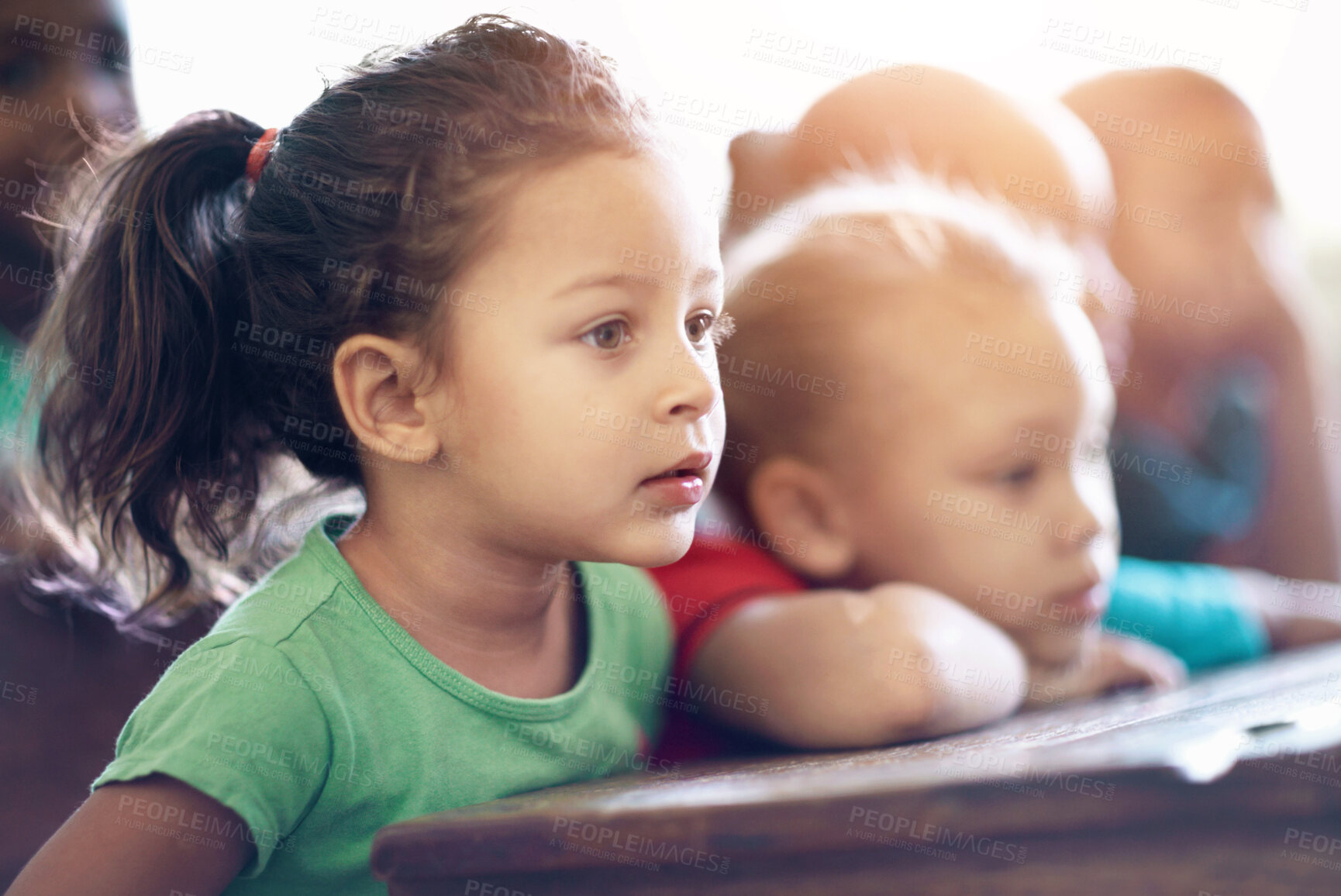 Buy stock photo Cute little preschoolers sitting in a classroom together