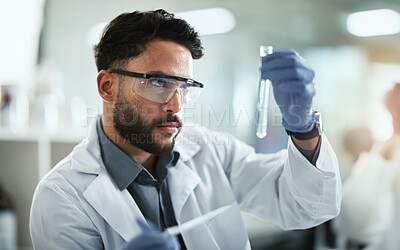 Buy stock photo Science, research and man with test tube in lab for solution, medical and pharmaceutical study. PPE, scientist and idea with glass vial for chemistry development, innovation and antiviral compound