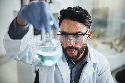 Buy stock photo Science, research and man with beaker in lab for solution, inspection and pharmaceutical development. Scientist, PPE and glass container analysis for chemistry innovation, study or antiviral compound