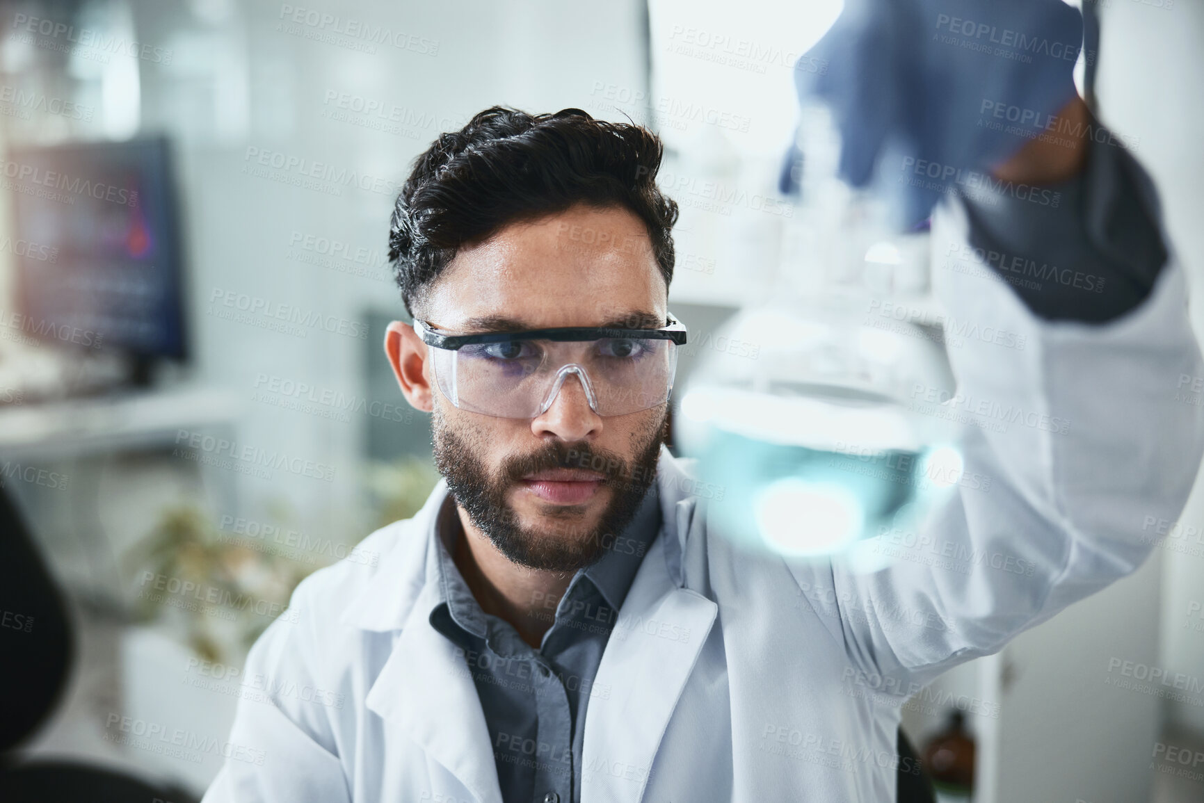 Buy stock photo Scientist, research and man with beaker in lab for inspection,  medical and pharmaceutical study. Science, PPE and analysis of glass container for antiviral compound, investigation and chemistry test