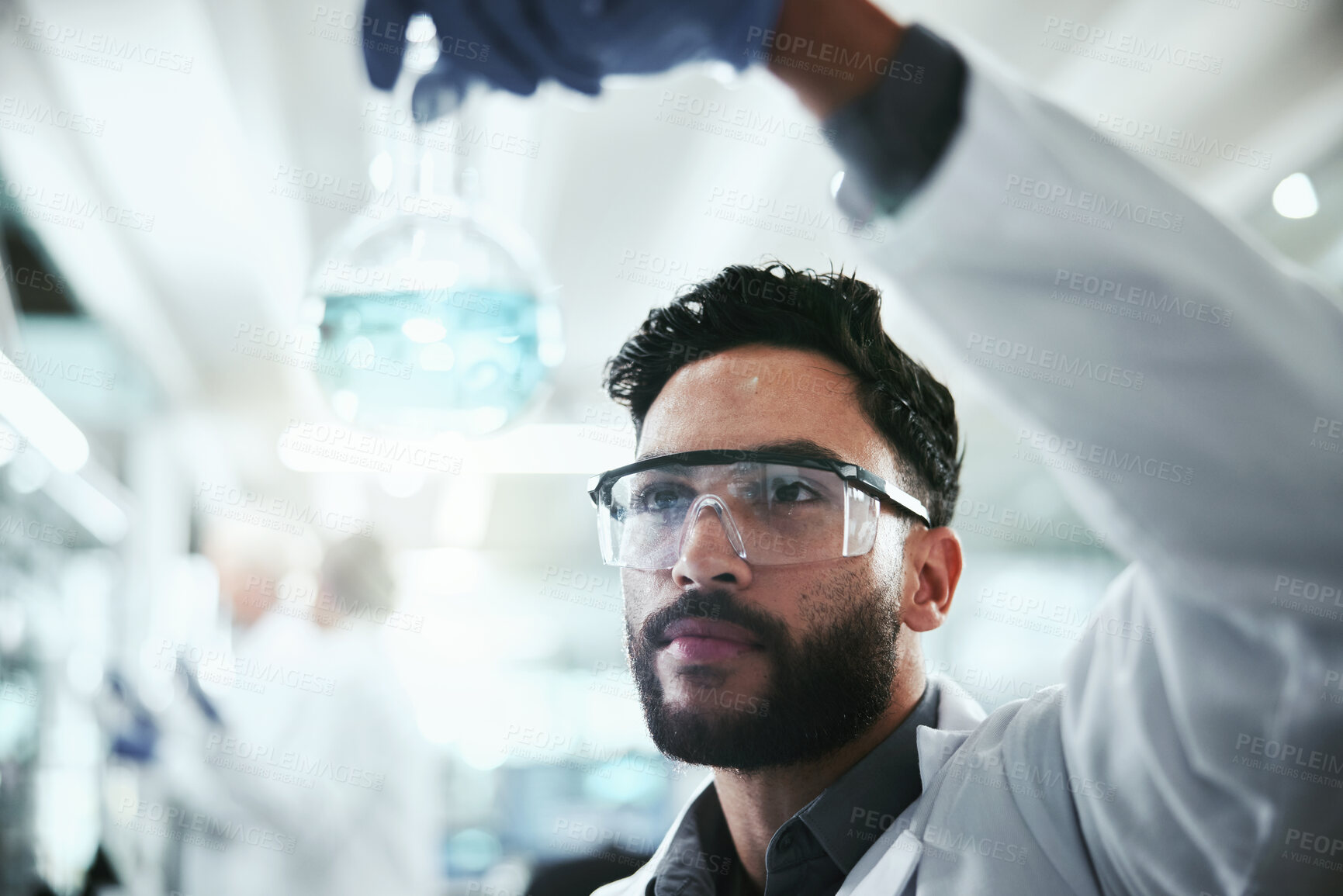 Buy stock photo Scientist, inspection and man with beaker in lab for research, solution and pharmaceutical development. Chemistry, science and analysis of glass container for antiviral compound, study and innovation