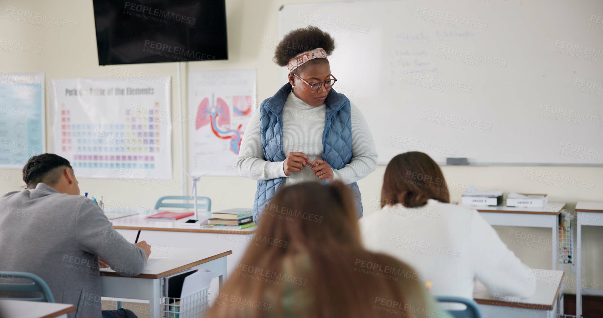 Buy stock photo Education, woman and teacher with students in classroom for biology exam, science test and writing assessment. High school, educator and monitor learners at academy for research project and learning