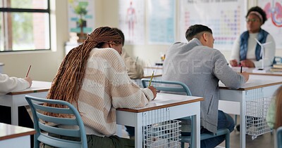 Buy stock photo Back, education or class in high school for test, lesson or biology assessment. Questionnaire, writing or students at desk for quiz, learning evaluation or concentration for knowledge and development