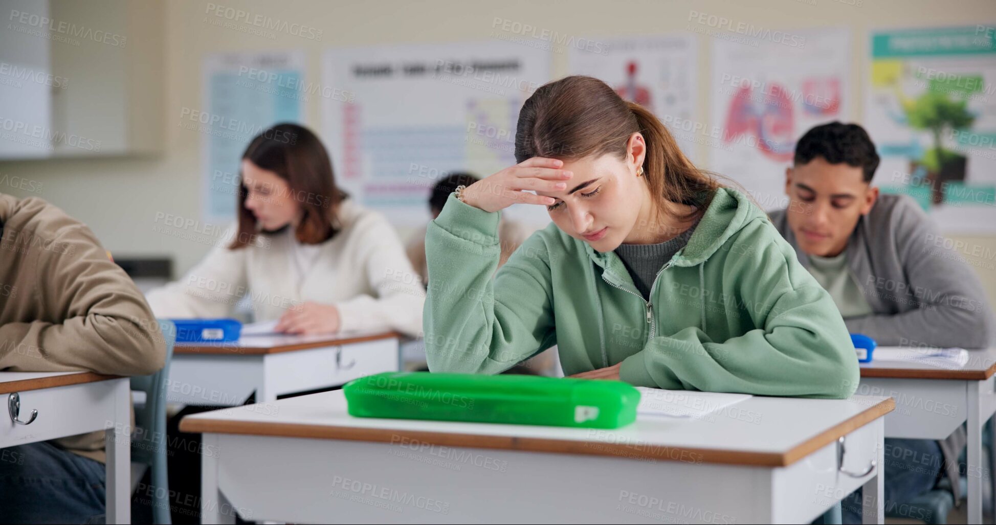 Buy stock photo School, classroom and student with stress for exam, test and assessment in lesson, college and quiz. Burnout, anxiety and girl with worry, frustrated and headache for studying, education and learning