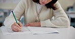 Education, exam and person at desk with test, paper and multiple choice assessment at school. Student, lesson or writing on document for answer, quiz or questionnaire in class for learning evaluation
