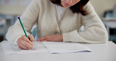 Buy stock photo Education, exam and person at desk with test, paper and multiple choice assessment at school. Student, lesson or writing on document for answer, quiz or questionnaire in class for learning evaluation