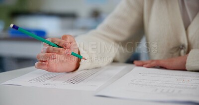 Buy stock photo Education, exam and hands at desk with paper, test and multiple choice assessment at school. Student, person or writing on document for answer, quiz or questionnaire in class for learning evaluation