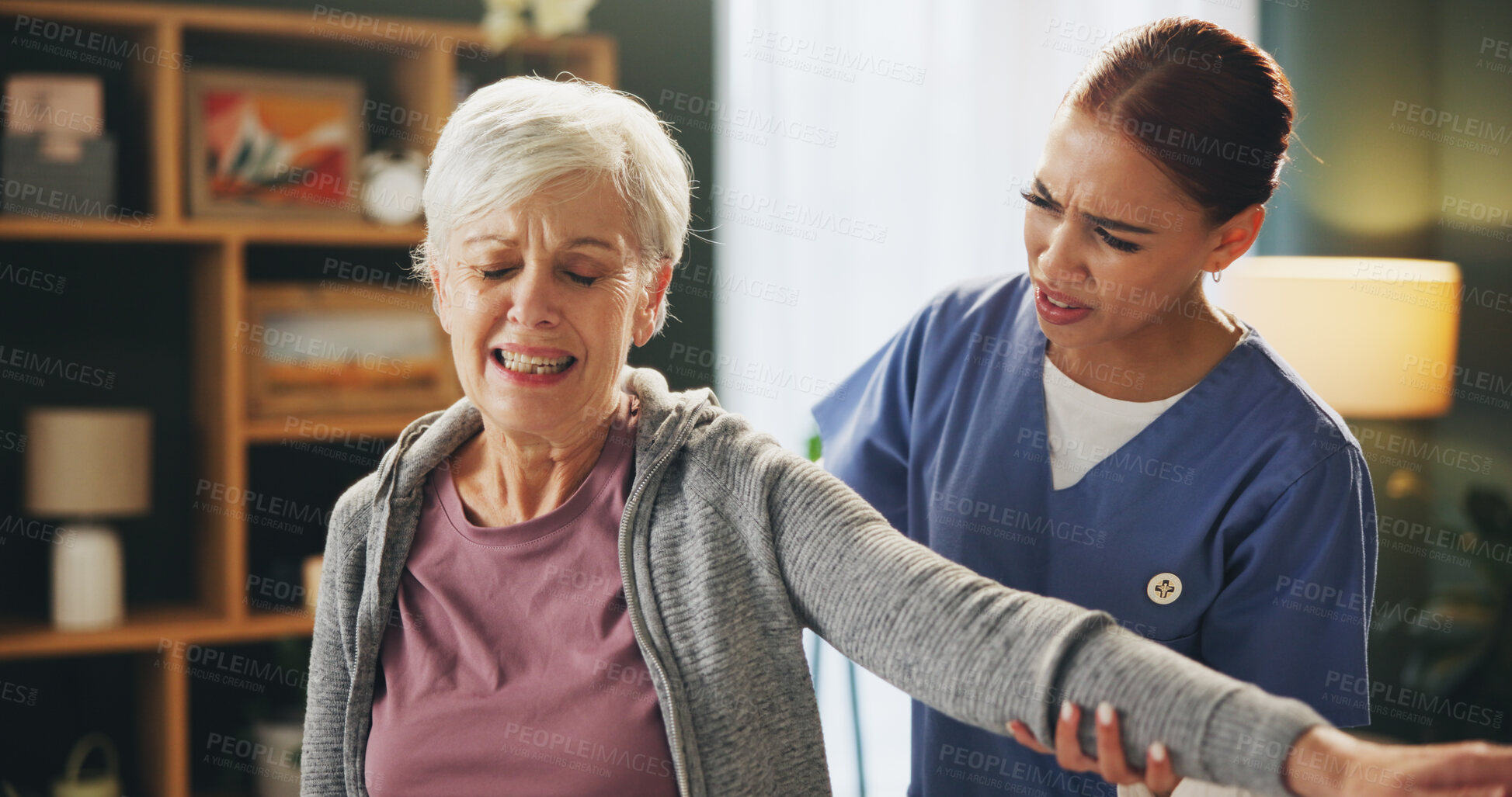 Buy stock photo Women, physiotherapist and senior patient with injury on arm stretching for rehabilitation, support and healthcare. People, retirement home and happy for fitness, exercise and training with pain