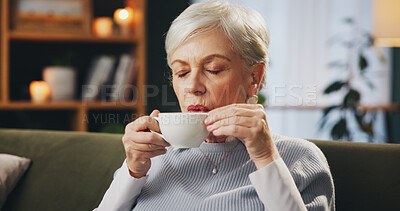 Buy stock photo Senior woman, sofa and drinking coffee on break to relax, chill and thinking at nursing home. Female person, living room and eyes closed with tea on couch as pensioner to enjoy, wellness or self care