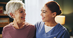 Healthcare, smile and nurse with senior woman in assisted living for medical consultation. Happy, bonding and caregiver hug elderly female patient for kindness at wellness checkup in retirement home.