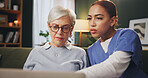 Healthcare, laptop and old woman with nurse on sofa in retirement home for medical advice or checkup. Assisted living, computer and consulting with medical professional talking to senior patient