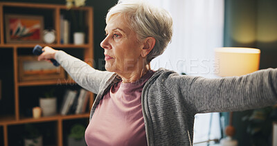 Buy stock photo Senior woman, weightlifting and stretching with dumbbells for exercise, workout or balance at home. Elderly female person with light weights for lifting or warm up in fitness or training at house