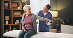 Women, caregiver and senior patient with dumbbells for rehabilitation, support and healthcare. People, nursing home and physiotherapist for fitness, exercise and training for wellbeing or arthritis