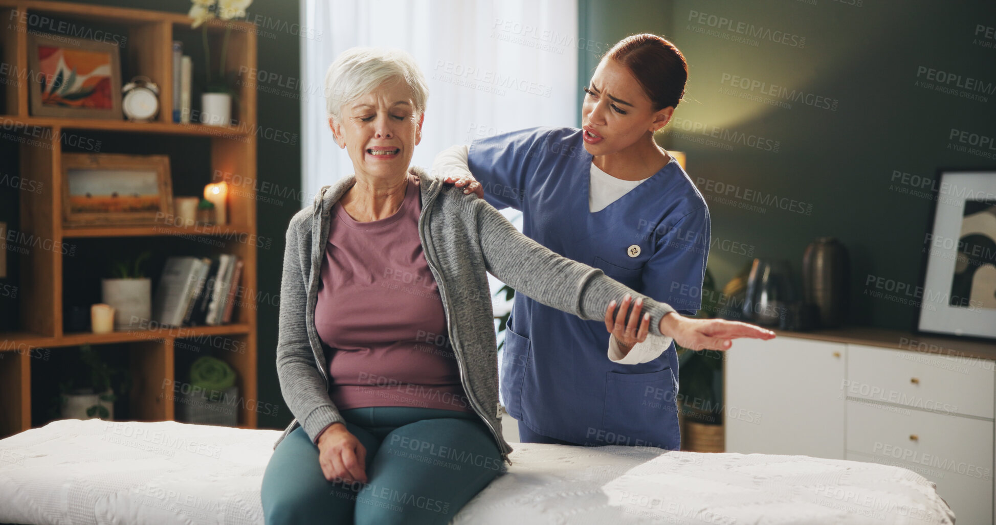 Buy stock photo Women, physiotherapist and senior patient with arm stretching for rehabilitation, support and healthcare. People, retirement home and pain for fitness, exercise and training for arthritis and scared