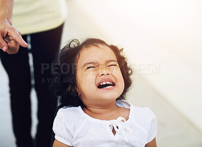 Buy stock photo A little girl being scolded for being naughty