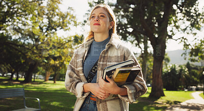 Buy stock photo Student, woman and books in park for walk to class with education, learning or thinking for development at campus. Person, smile and vision on path, perspective and scholarship at college in Germany