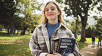 Student, woman and books in park, smile and portrait on walk for education, learning and development at campus. Person, happy and outdoor on path in nature for scholarship at university in Germany