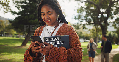 Buy stock photo Student, black woman and books in park on smartphone on walk with education, learning or chat on web at campus. Person, reading and app with smile, social network or marketing at college in Brazil