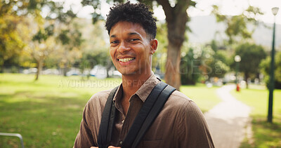 Buy stock photo Student, man and smile in portrait, park and walk to class for education, learning and development at campus. Person, happy and outdoor on path with backpack for scholarship at university in Brazil