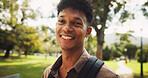 Student, man and happy in portrait, park and walk to class for education, learning and development at campus. Person, smile and outdoor on path with backpack for scholarship at university in Brazil