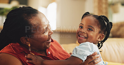 Buy stock photo Happy, grandmother and holding child at house for bonding, love and care together of family support in lounge. Smile, senior black woman and girl with embrace for trust, connection and relationship