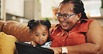 Grandmother, child and laugh with tablet at house for streaming movie, bonding and video on social media. Happy, black family and girl relax with digital for online ebook, comedy game and living room