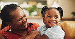 Happy, grandmother and child laughing at house for bonding, love and care together of family support. Smile, senior black woman and girl with embrace for funny joke, comic meme, retirement and lounge