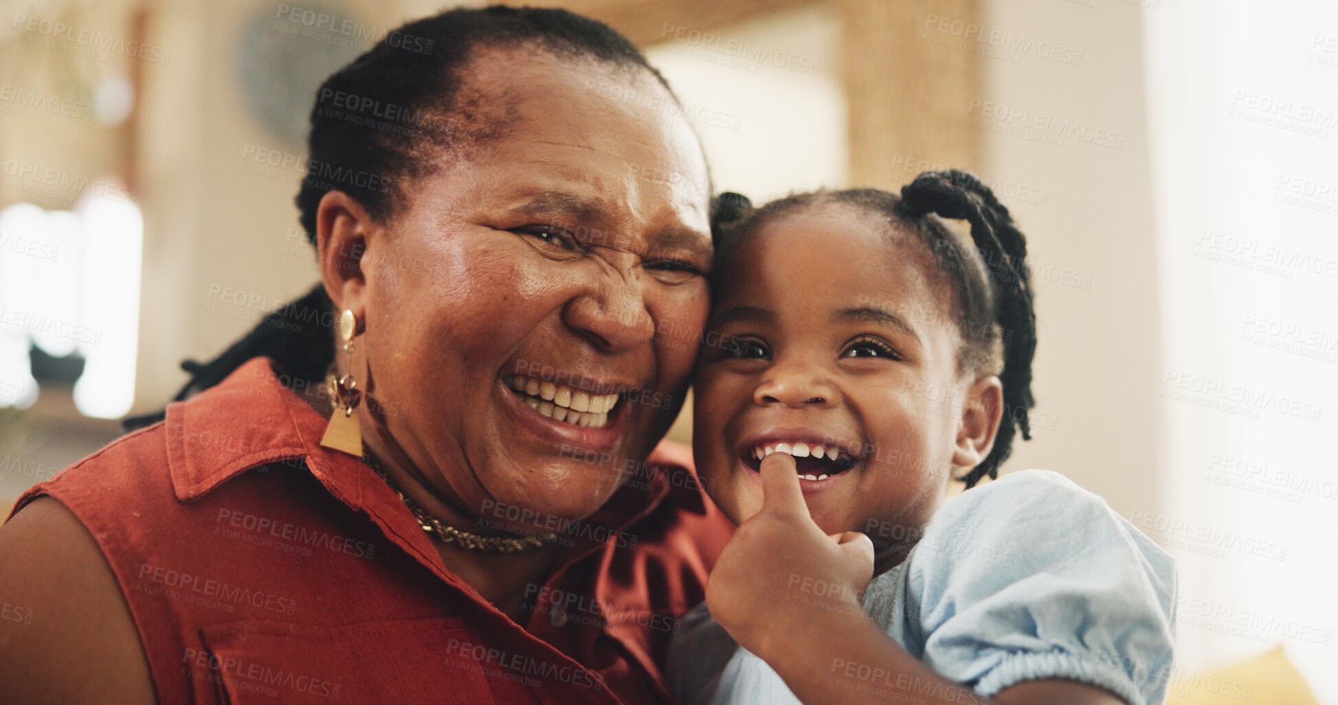 Buy stock photo Smile, grandmother and child laughing at house for bonding, love and care together for family support. Happy, senior black woman and girl, embrace and funny joke, affection or retirement in lounge