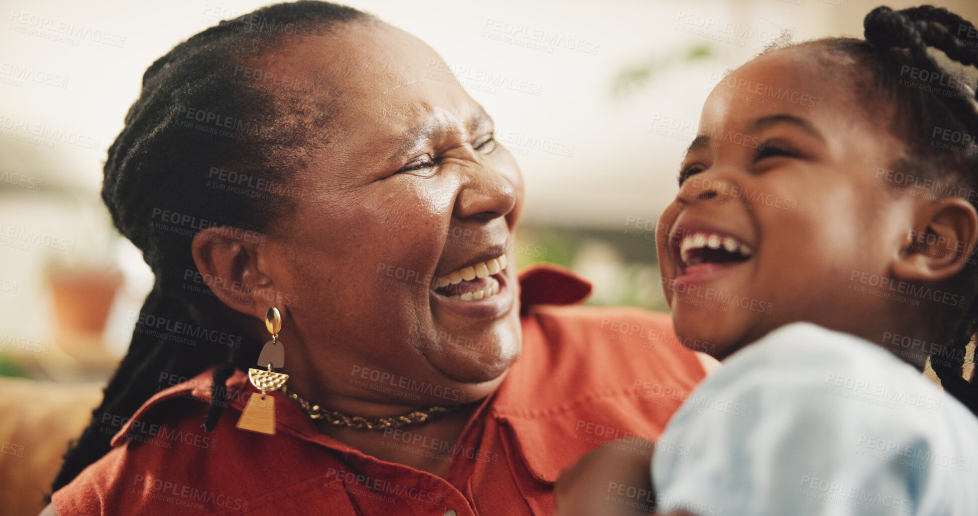 Buy stock photo Smile, grandmother and kid laughing at house for bonding, love and care together of family support. Happy, senior black woman and girl with embrace for funny joke, comic meme, retirement and lounge