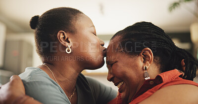 Buy stock photo Happy, kiss and black woman with senior mother in home hugging for womens day celebration. Love, bonding and African female person embracing mom for connection in living room at family house.