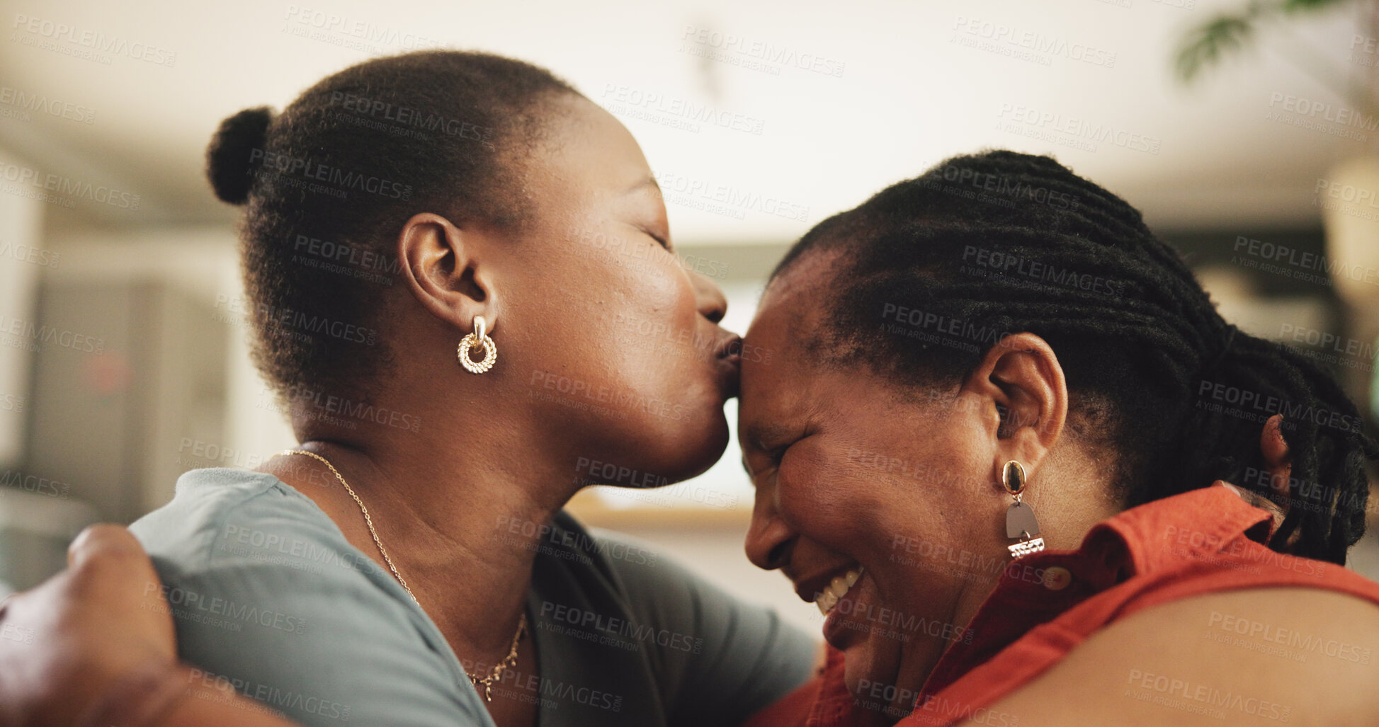 Buy stock photo Happy, kiss and black woman with senior mother in home hugging for womens day celebration. Love, bonding and African female person embracing mom for connection in living room at family house.