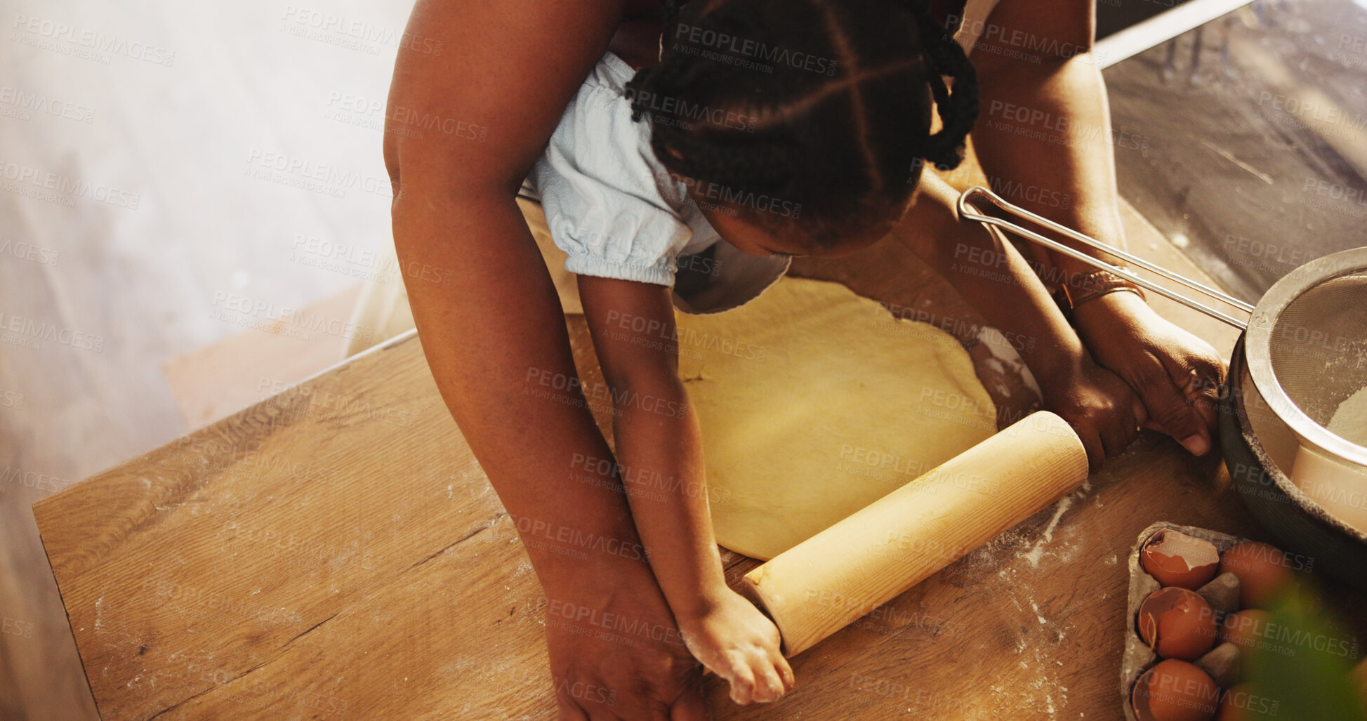 Buy stock photo Mother, child and teaching with cooking, pastry or nutrition as parent in home for education. Female person, kid and dough for learning, development and above kitchen counter, family or bonding