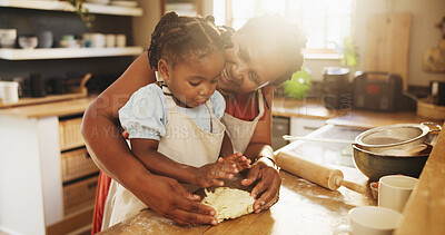 Buy stock photo Black woman, child and teaching with dough, cooking and nutrition for support, love and education. Grandmother, girl and baking for development, growth and kitchen as happy family in bonding in home